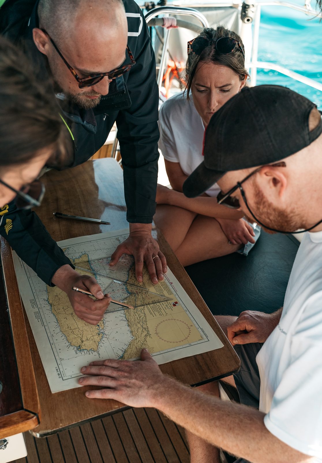 Skipper Academy participants practising navigation on board